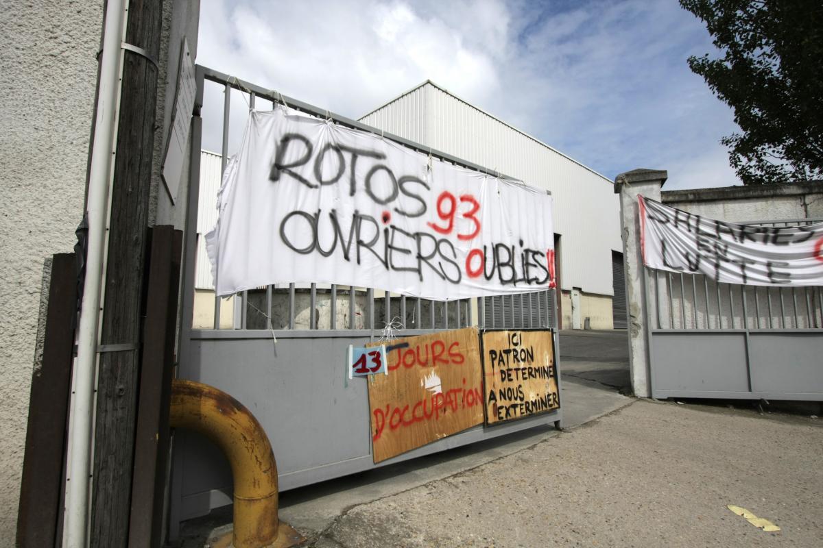 banderole Rotos93 ouvriers oubliés