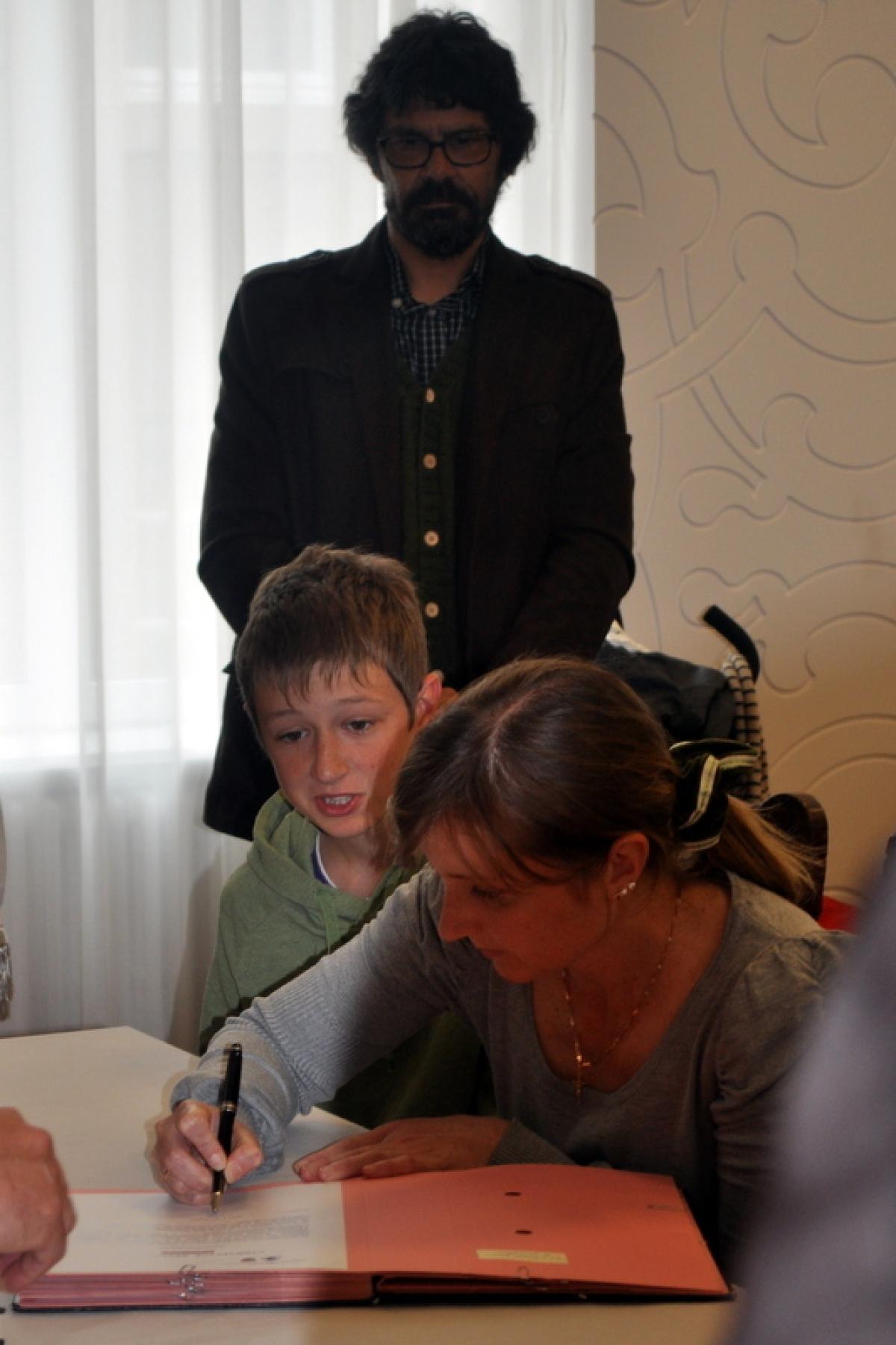 Signature de Mme K.
