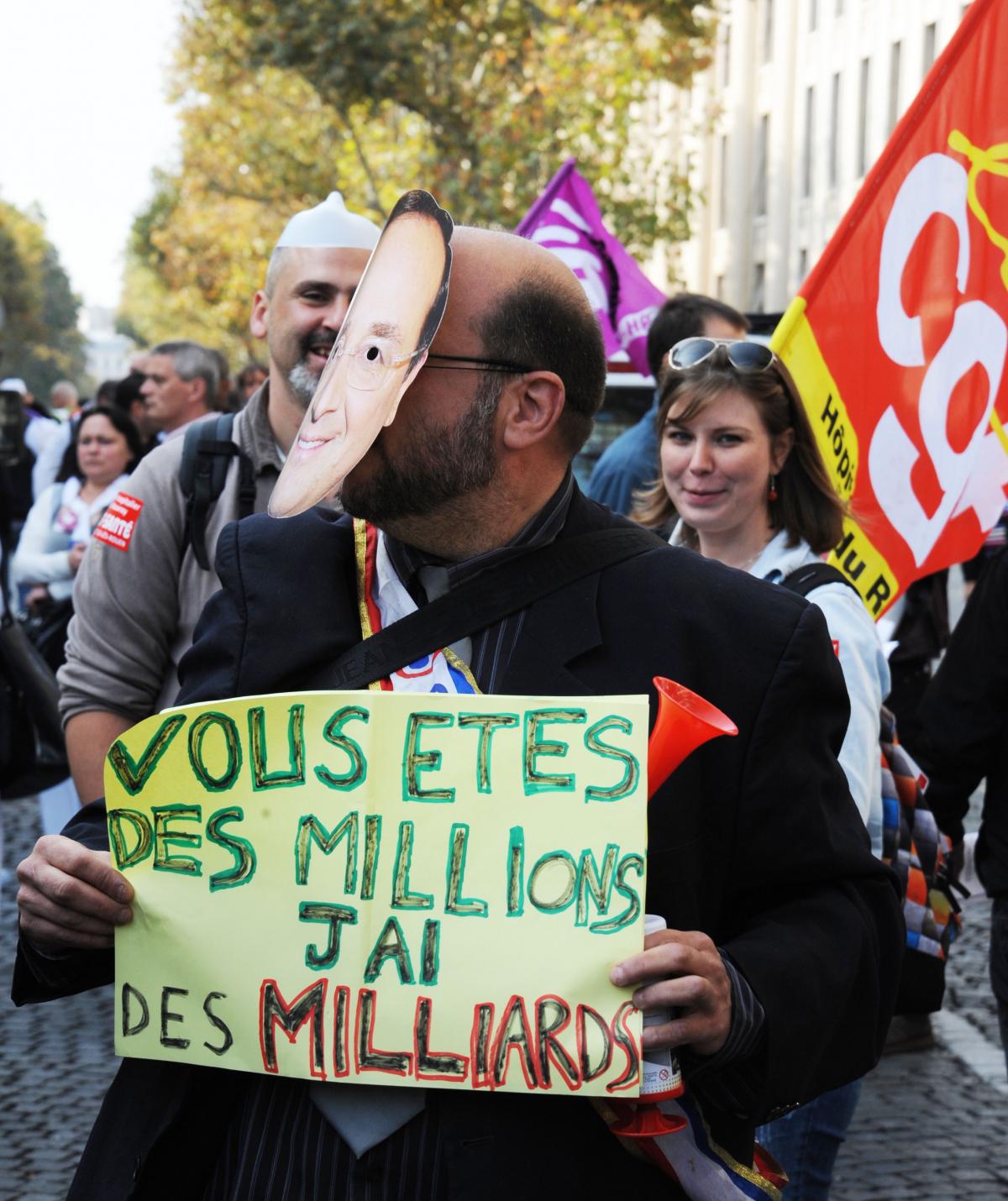 Pancarte vous êtes des millions j'ai des milliards